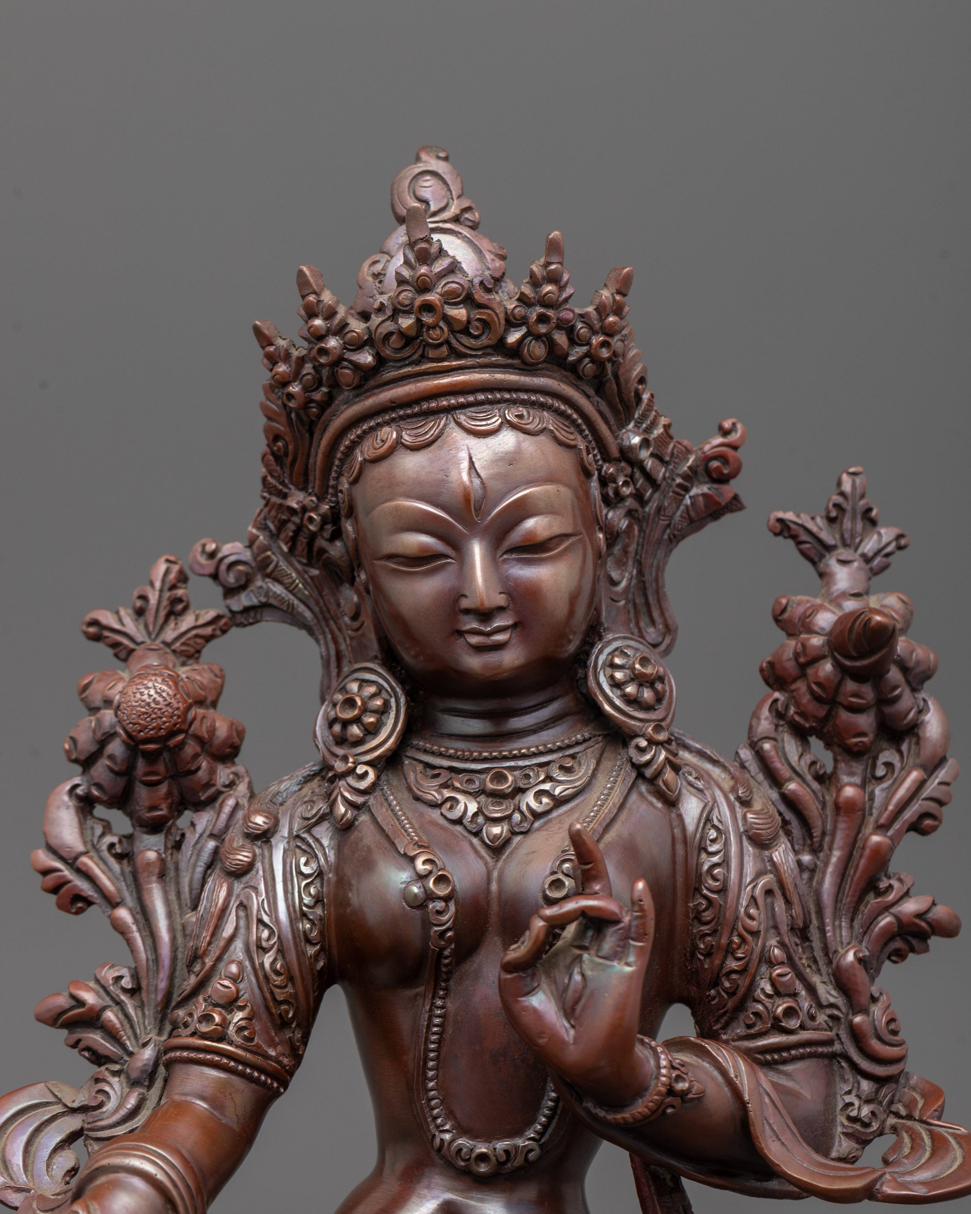 Traditional White Tara oxidized copper sculpture with intricate carvings and lotus flower