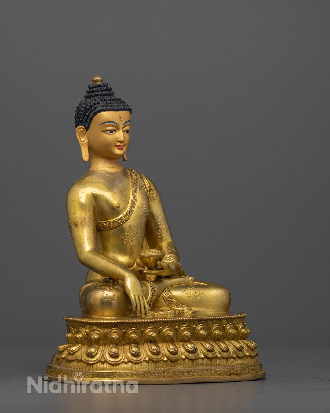 Side view of Traditional copper-based Shakyamuni Buddha sculpture featuring