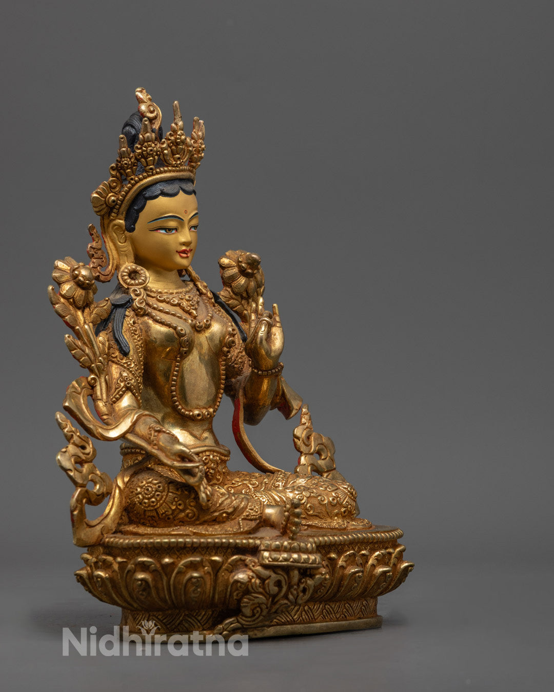 Traditional lost wax method Green Tara sculpture in meditation pose, featuring hollow base for auspicious mantra insertion.