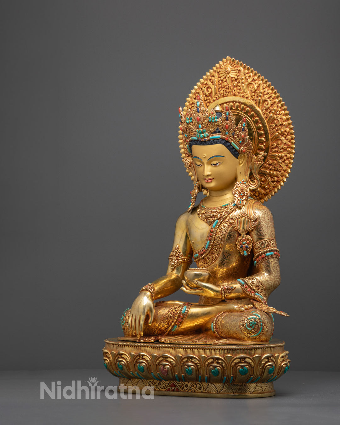 Traditional Shakyamuni Buddha statue hand-carved from premium copper, adorned with 24k fire-gilded gold and yellow acrylic coloring, Nepal-made.