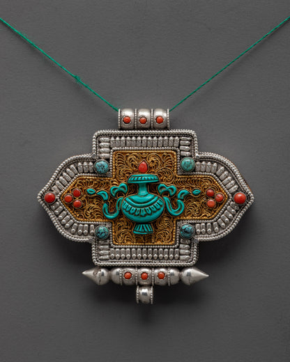 Treasure Vase Locket front view showing coral, turquoise, and gold filigree design