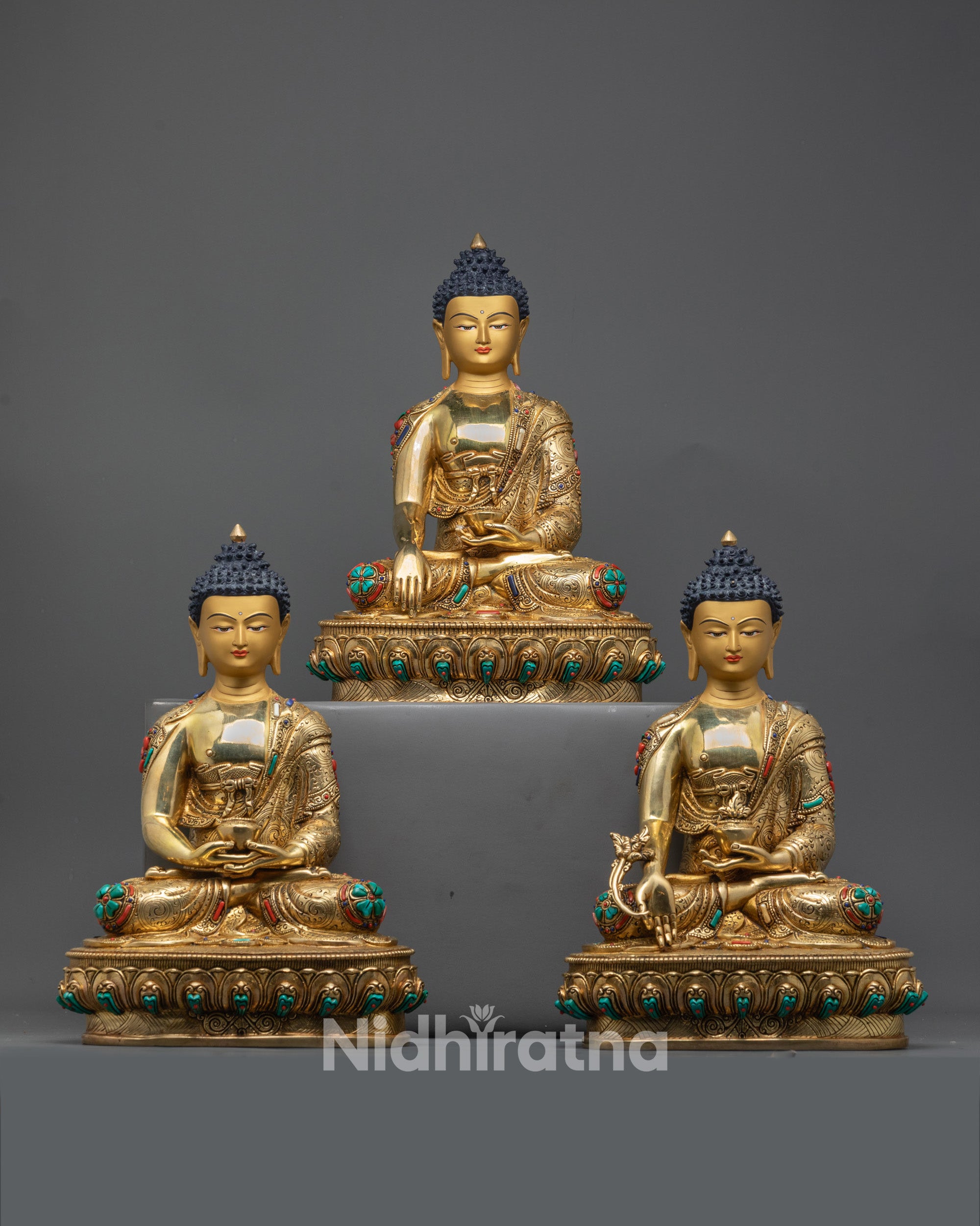 Trio Buddha Statue Set handcrafted in Nepal with 24K gold gilding on a solid copper base for spiritual blessings.

