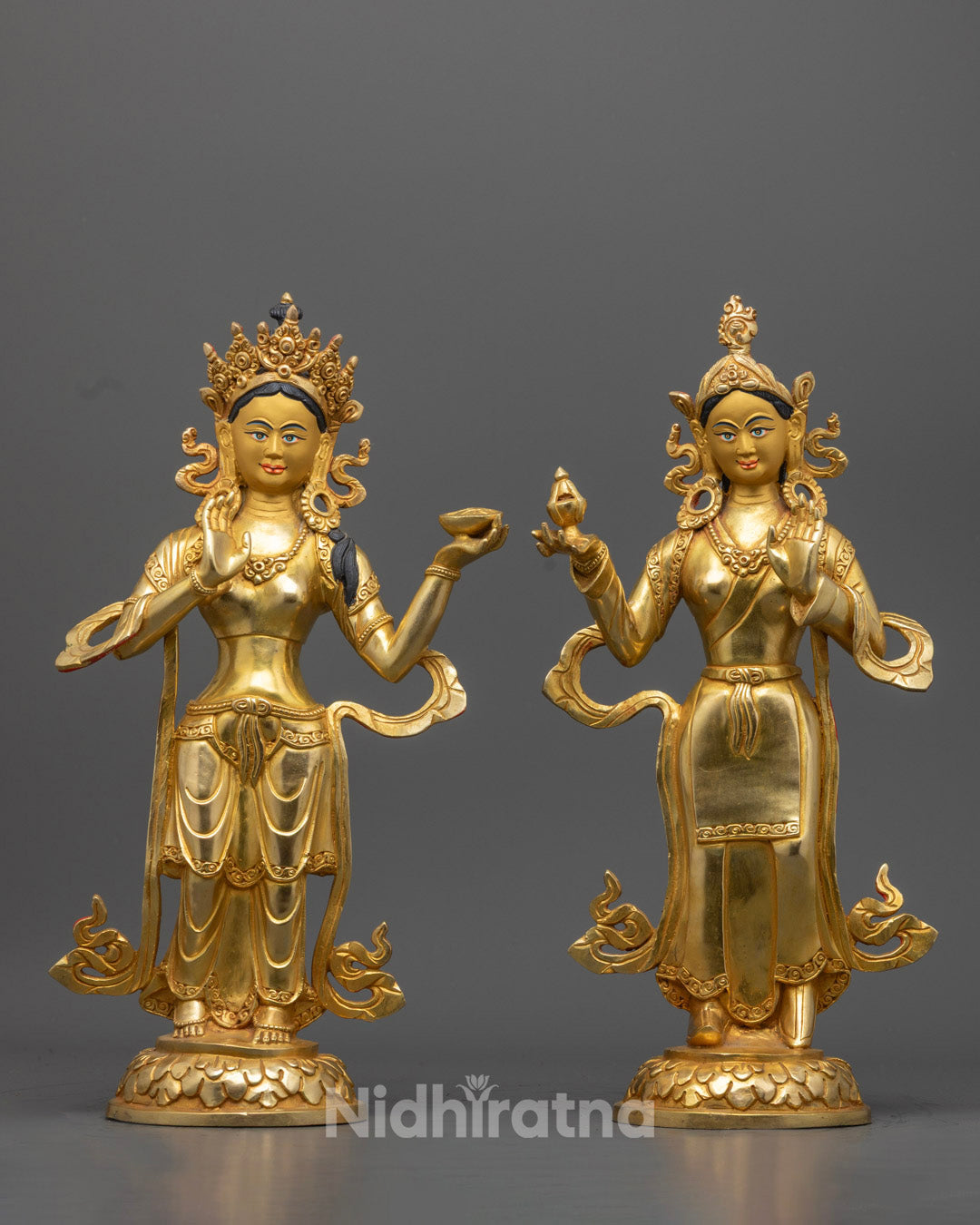 Twin depiction of Yeshe Tsogyal and Mandarva statues side by side, showcasing the sacred consorts of Guru Padmasambhava in radiant detail.