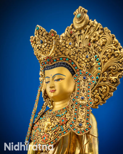 Upper close up of sacred Jowo Rinpoche Buddha statue gold-gilded face
