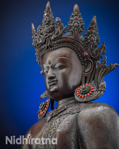 Upper face close up of Crowned Shakyamuni Buddha oxidized copper statue