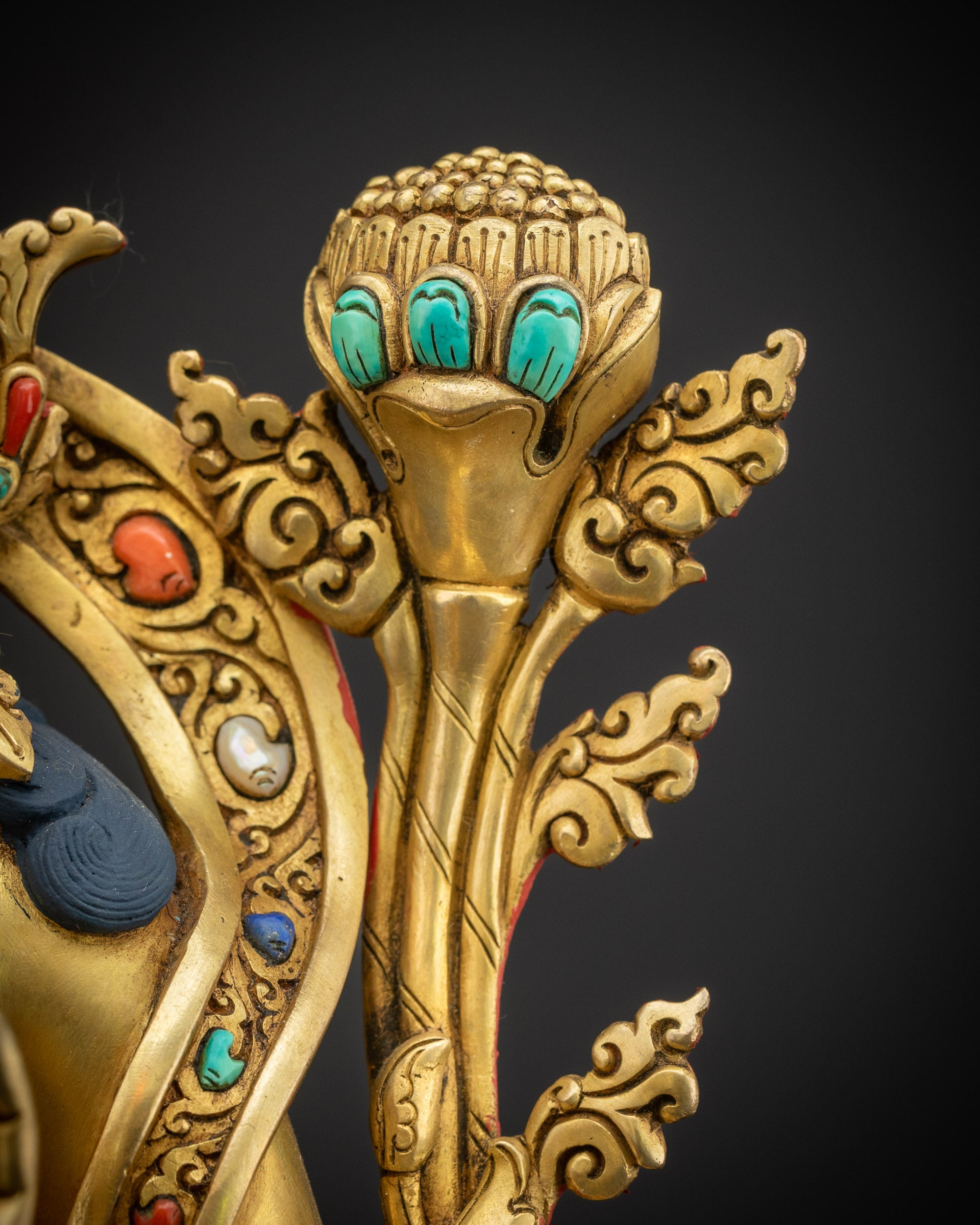 Utpala flower close up on Green Tara Statue with gold fire-gilding