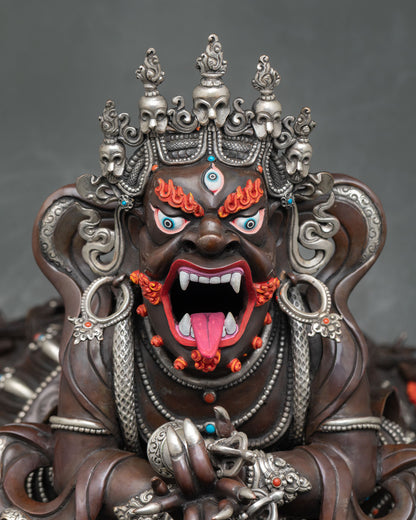 Vajradhaka statue close up view fierce face details open mouth fangs gold accents and sacred Himalayan craftsmanship