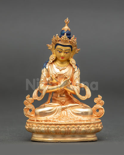 Vajradhara Buddha sculpture with gold painted face and fire gilded body seated on lotus