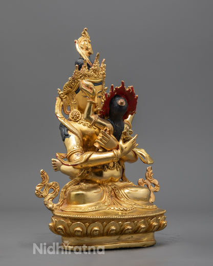 Vajradhara with Consort statue highlighting the serene expressions and intricate ornamentation of traditional Himalayan art.