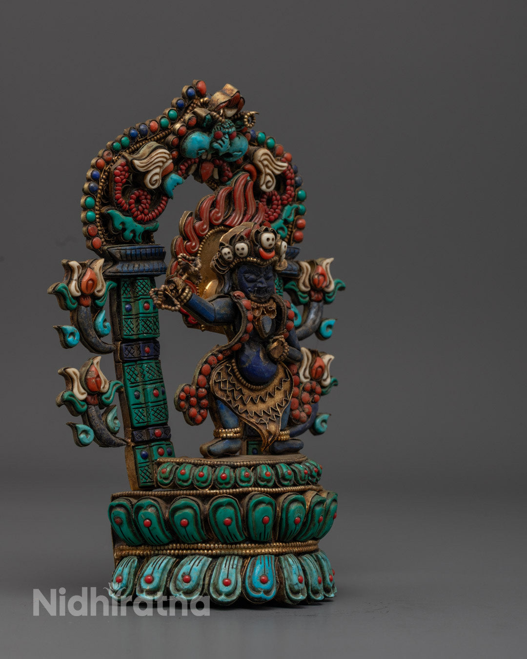 Vajrapani Buddha statue adorned with turquoise, coral, and lapis lazuli semi-precious stones