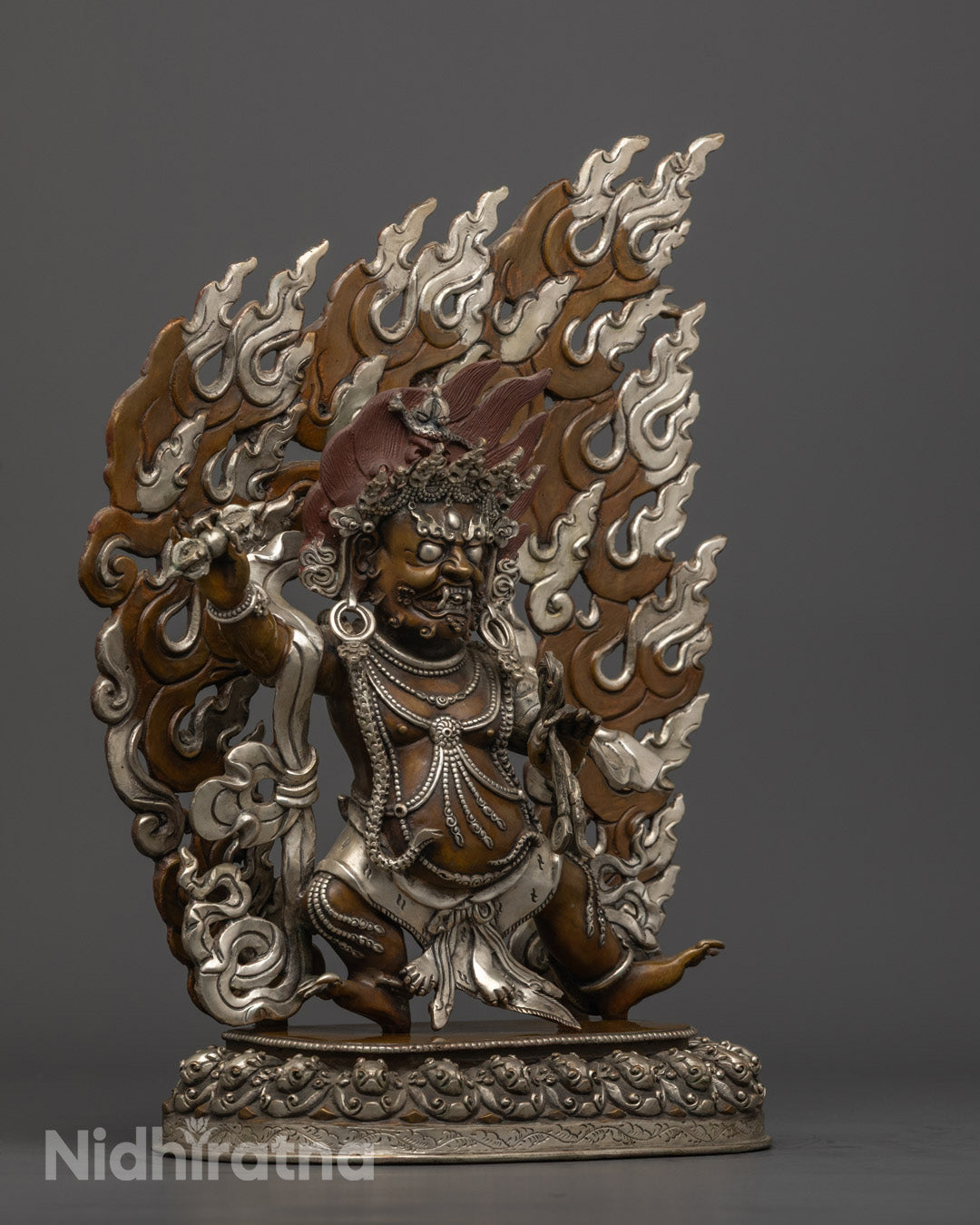 Vajrapani’s gold-gilded face and Vajra in right hand, symbolizing indestructible spiritual power and fierce protection