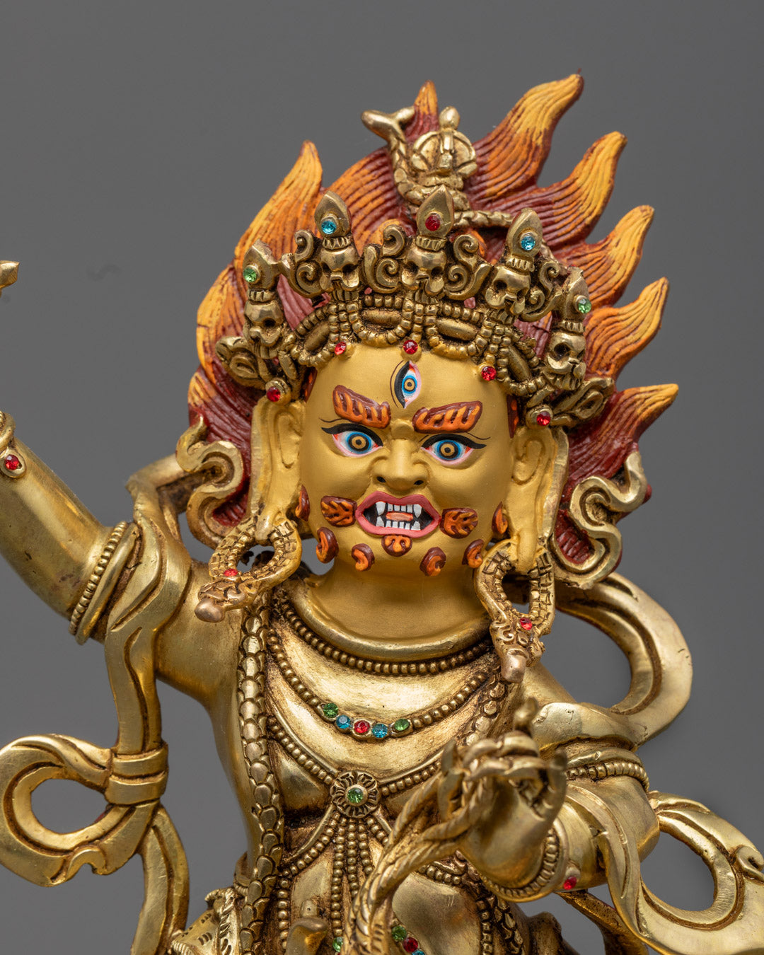 Vajrapani’s wrathful expression and raised vajra symbolize the destruction of ignorance and the fearless heart of compassion.