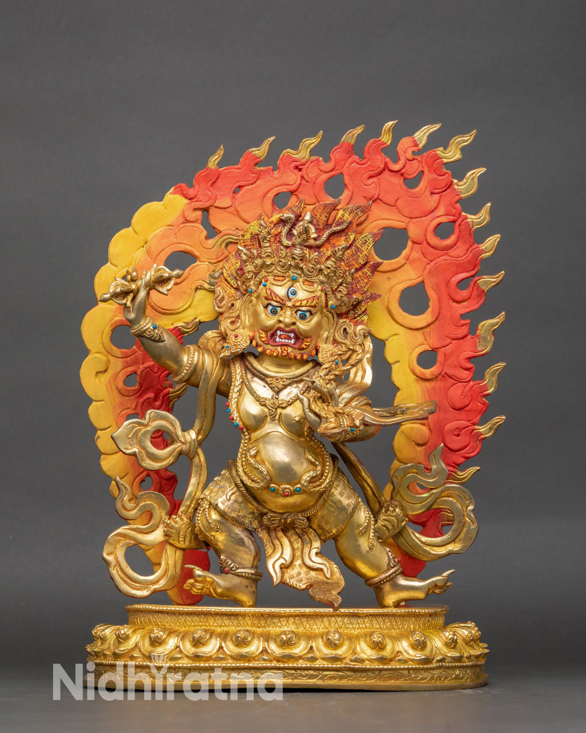 Vajrapani statue, gilded copper, wrathful face, vajra and lasso in raised arms