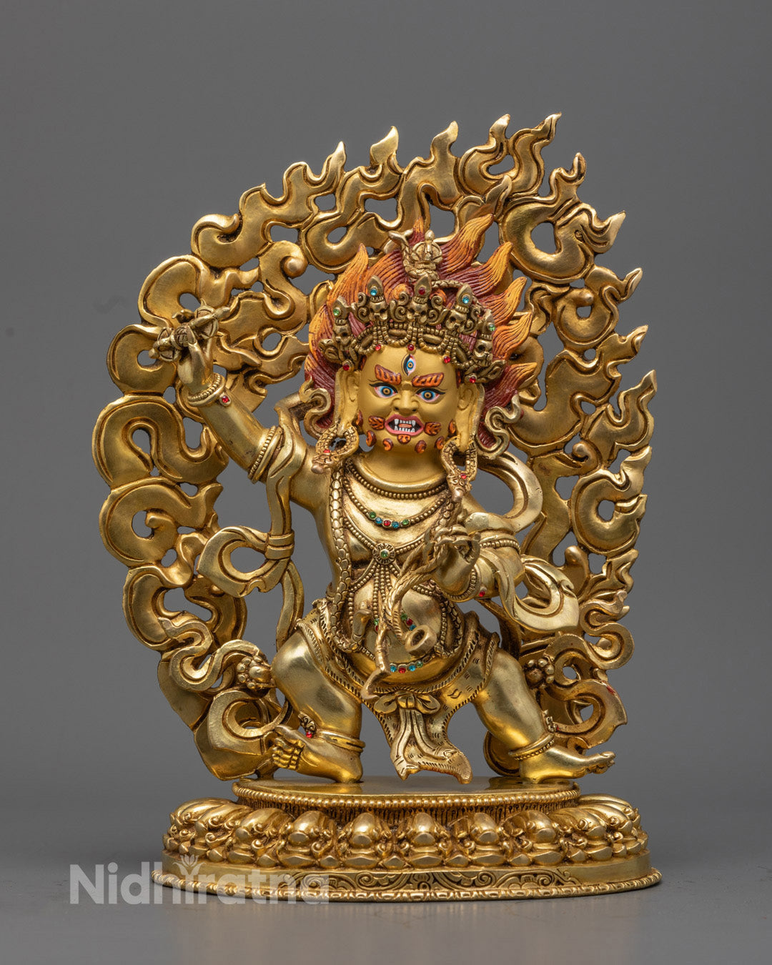 Vajrapani, the thunderbolt-wielding guardian of Buddha’s teachings, captured in a fierce copper and gold statue radiating unstoppable spiritual force.