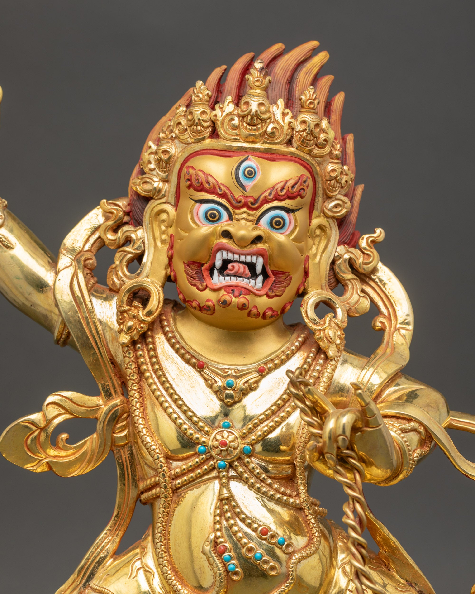 Vajrapani wrathful face with third eye gold-painted finish and vibrant colors