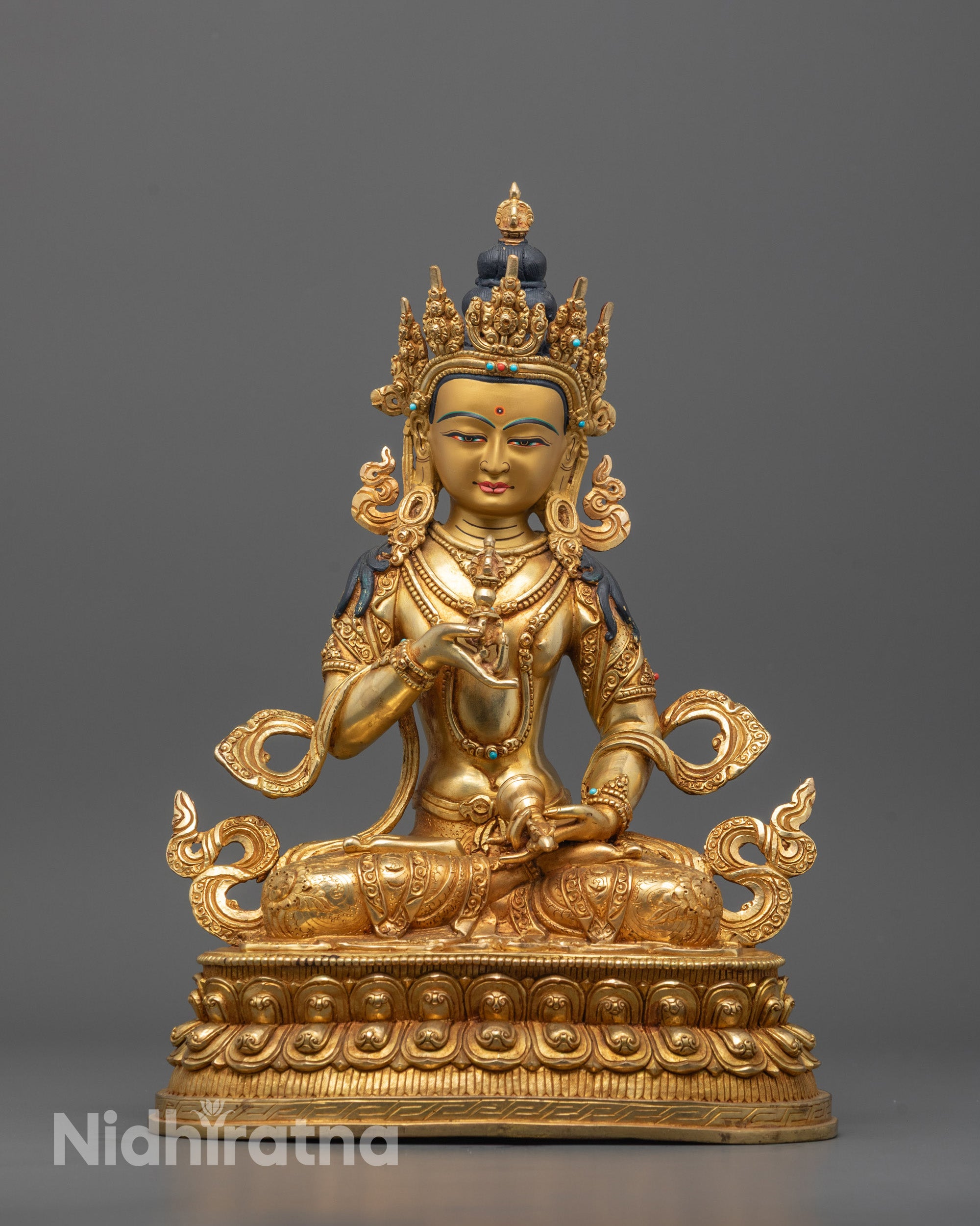 Vajrasattva Statue seated on lotus in meditative posture holding vajra and bell