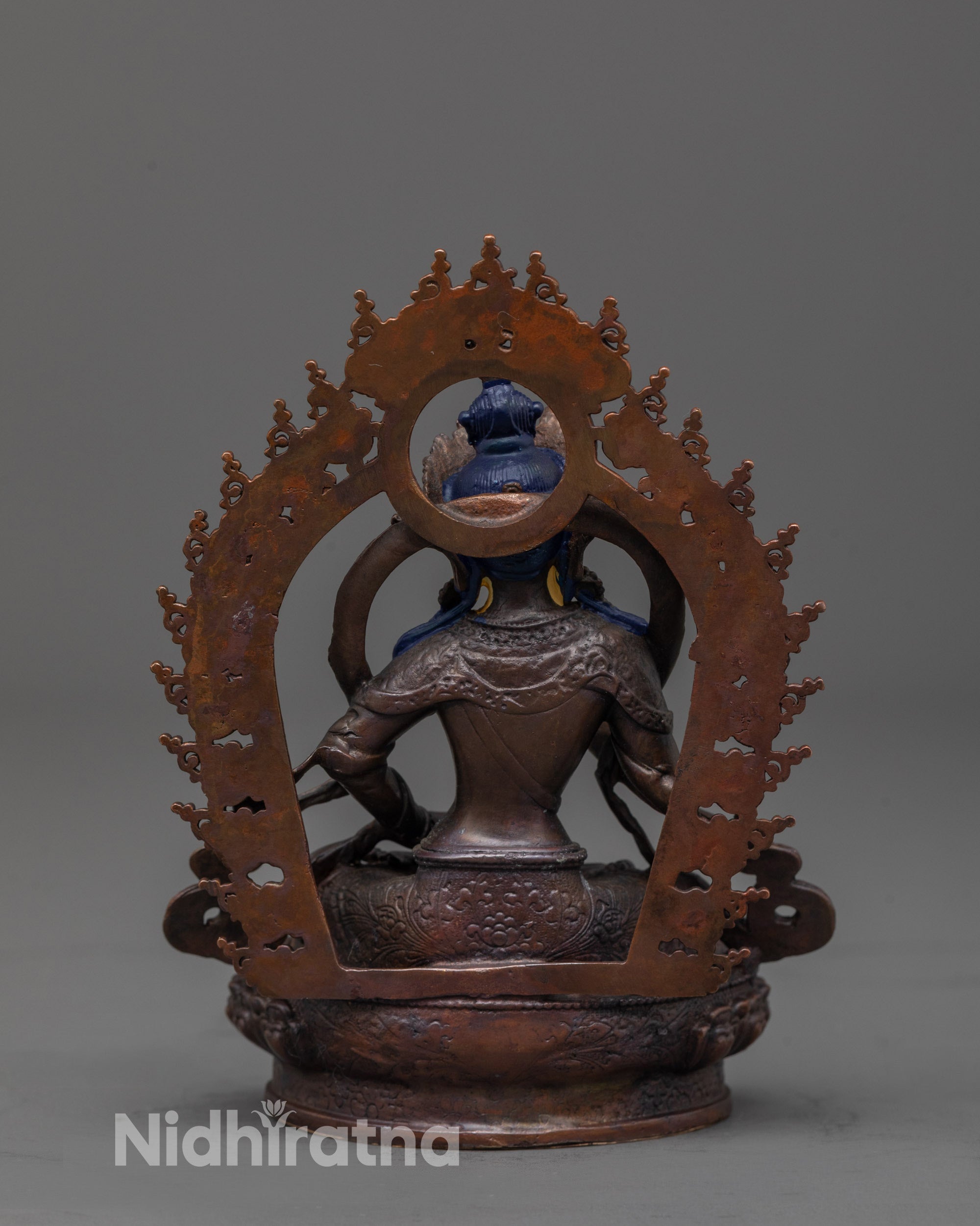 back view of oxidized copper vajrasattva statue highlighting robe details and deep-toned finish