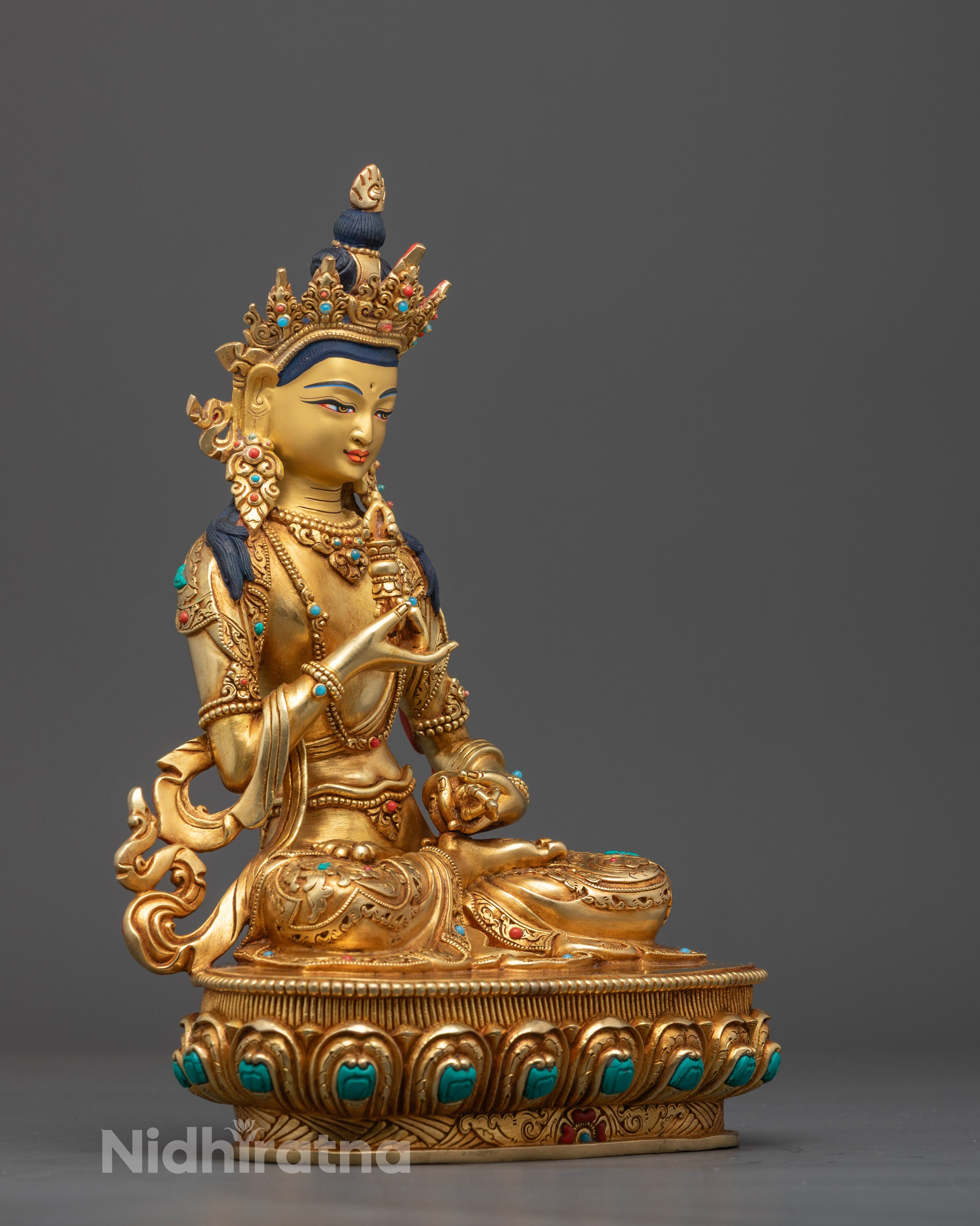 24K gold gilded Vajrasattva statue, Tibetan Buddhist deity on lotus base, adorned with turquoise and coral gems.
