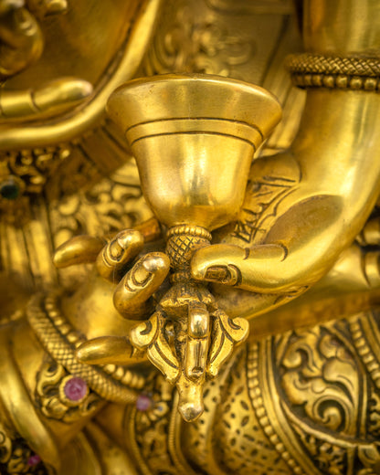 Close up of Vajrasattva Dorje Sempa statue holding ghanta (bell), symbolizing compassion in practice