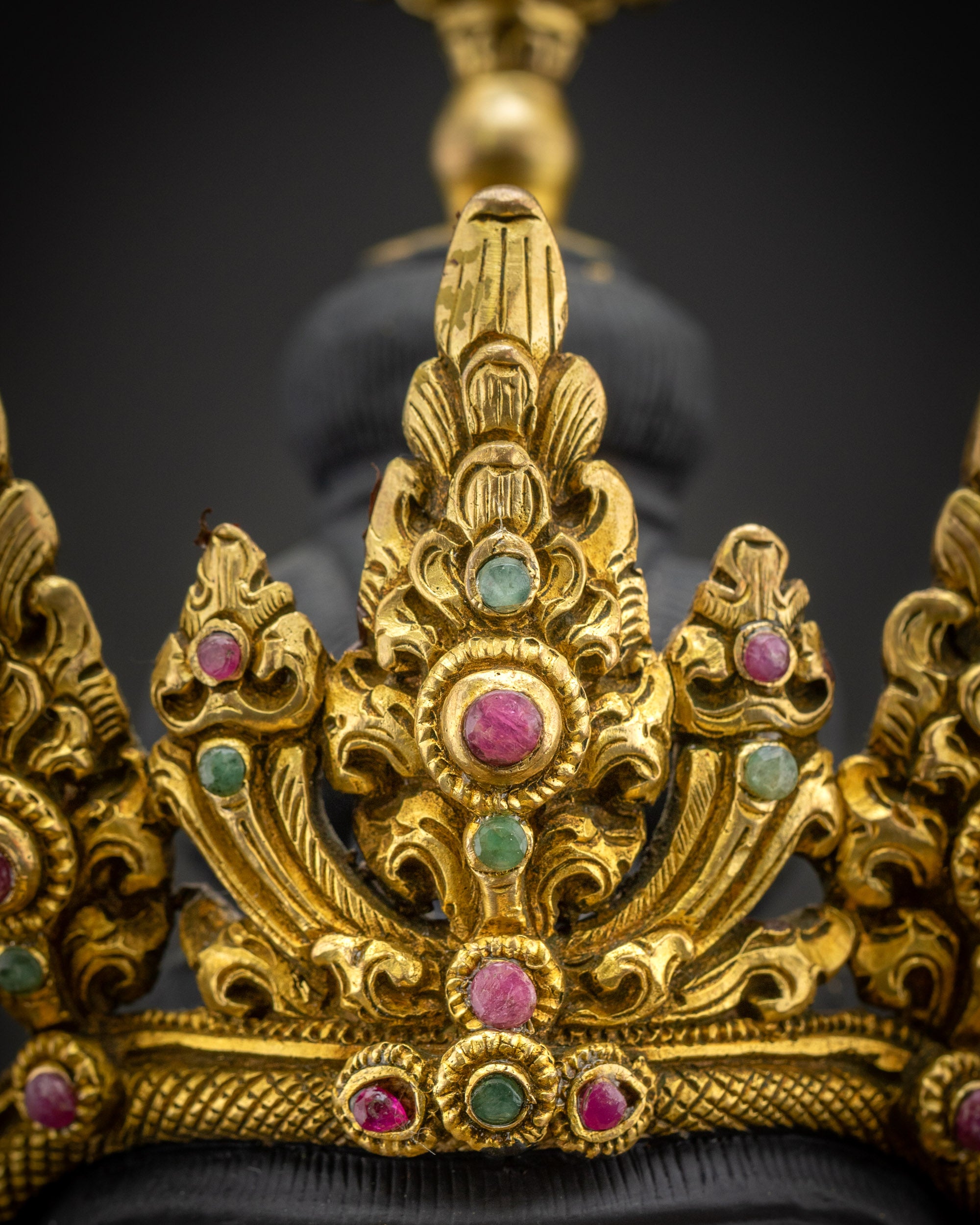 Close up of Vajrasattva Dorje Sempa five-jewelled crown with intricate carving and traditional Nepalese design