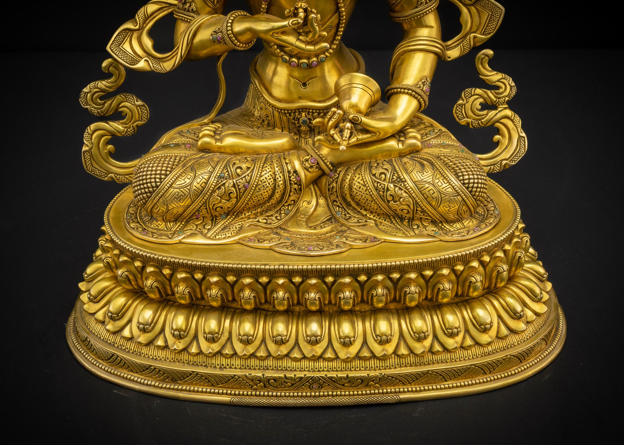 Front lower view of Vajrasattva Dorje Sempa seated on double-layered lotus pedestal with carved details