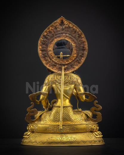 Back view of Vajrasattva statue highlighting floral halo and traditional Himalayan casting