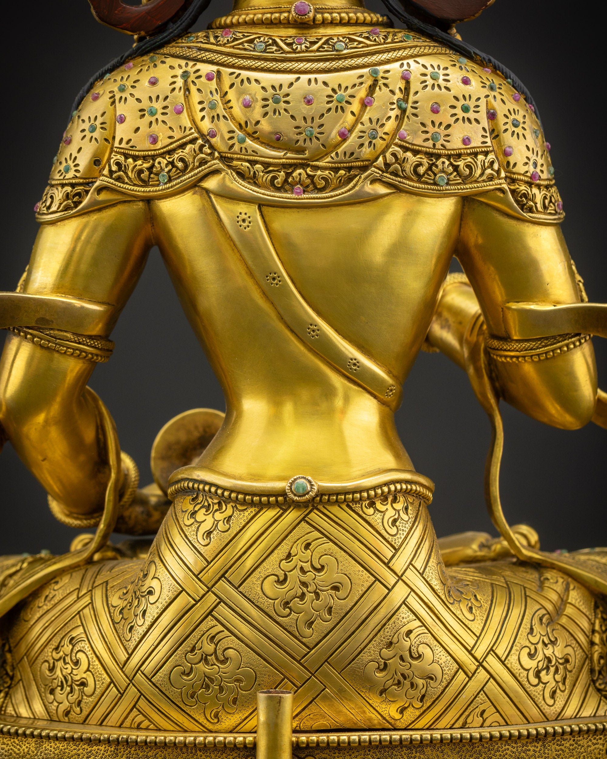Close up of Vajrasattva Dorje Sempa lower garment featuring carved symbolic patterns