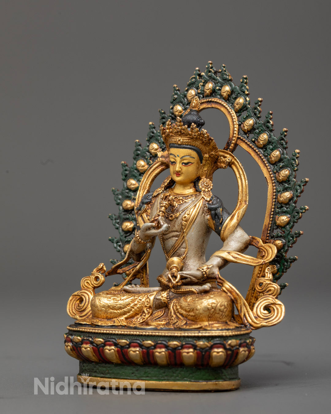 Vajrasattva Statue on lotus throne, showcasing intricate carvings, rich acrylic colors, and sacred mantra chamber