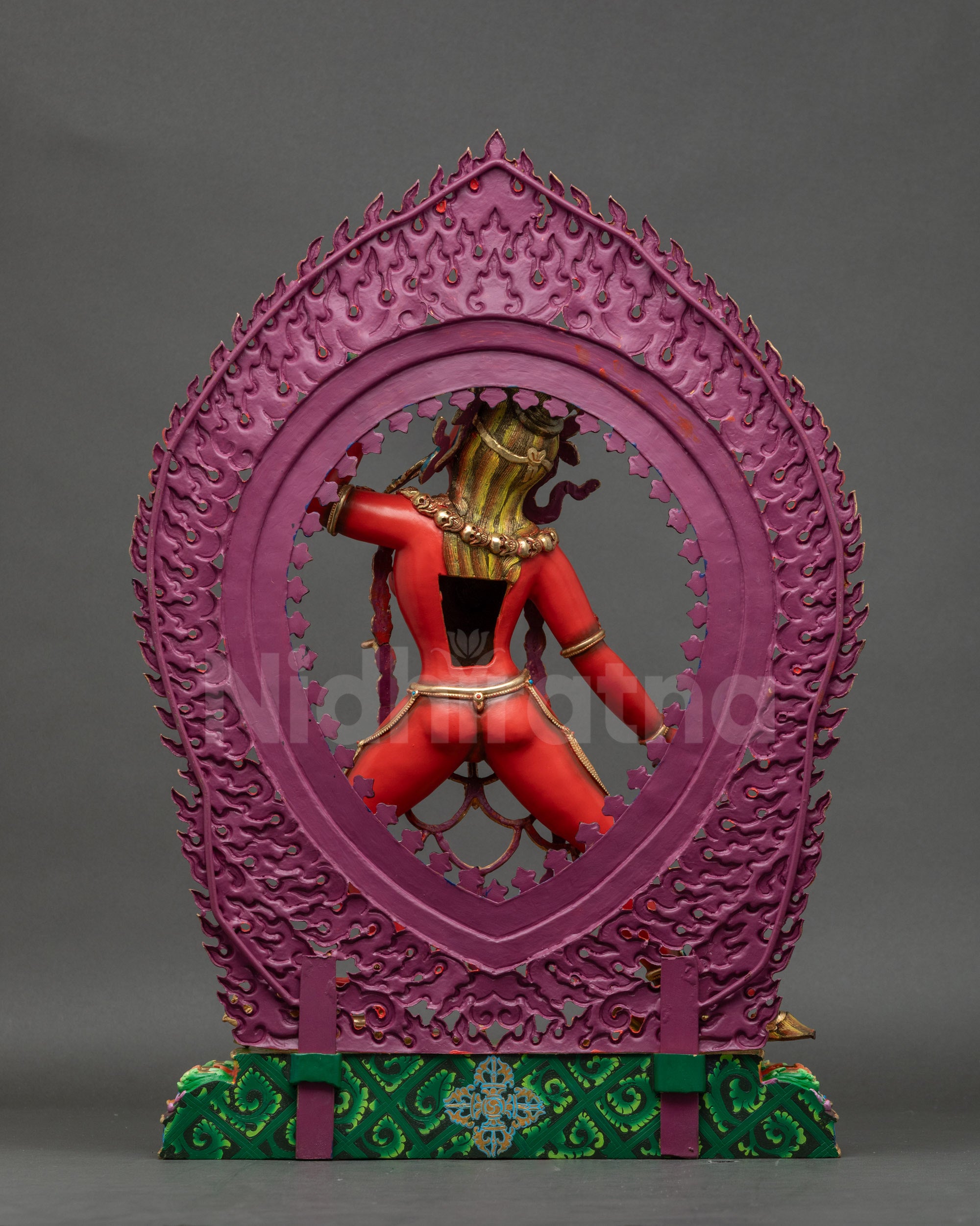 Vajrayogini Statue back view showing carved halo of flames and skull details