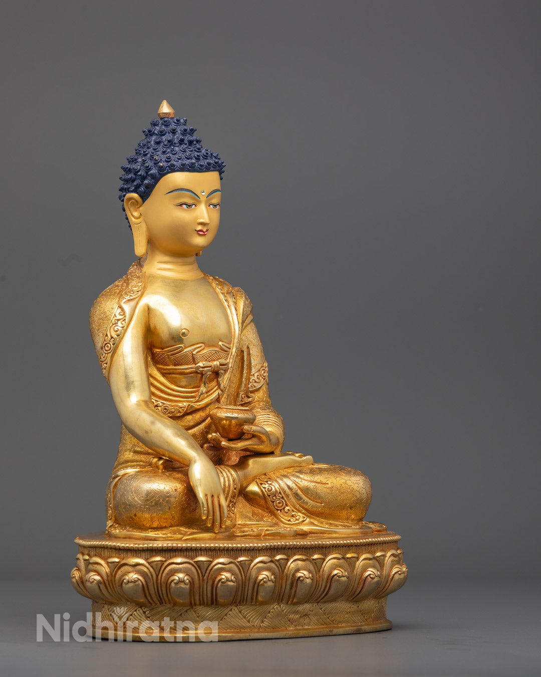 Vibrantly Painted Handcrafted Shakyamuni Buddha Statue Highlighting Ancient Lost Wax Casting and Spiritual Devotion