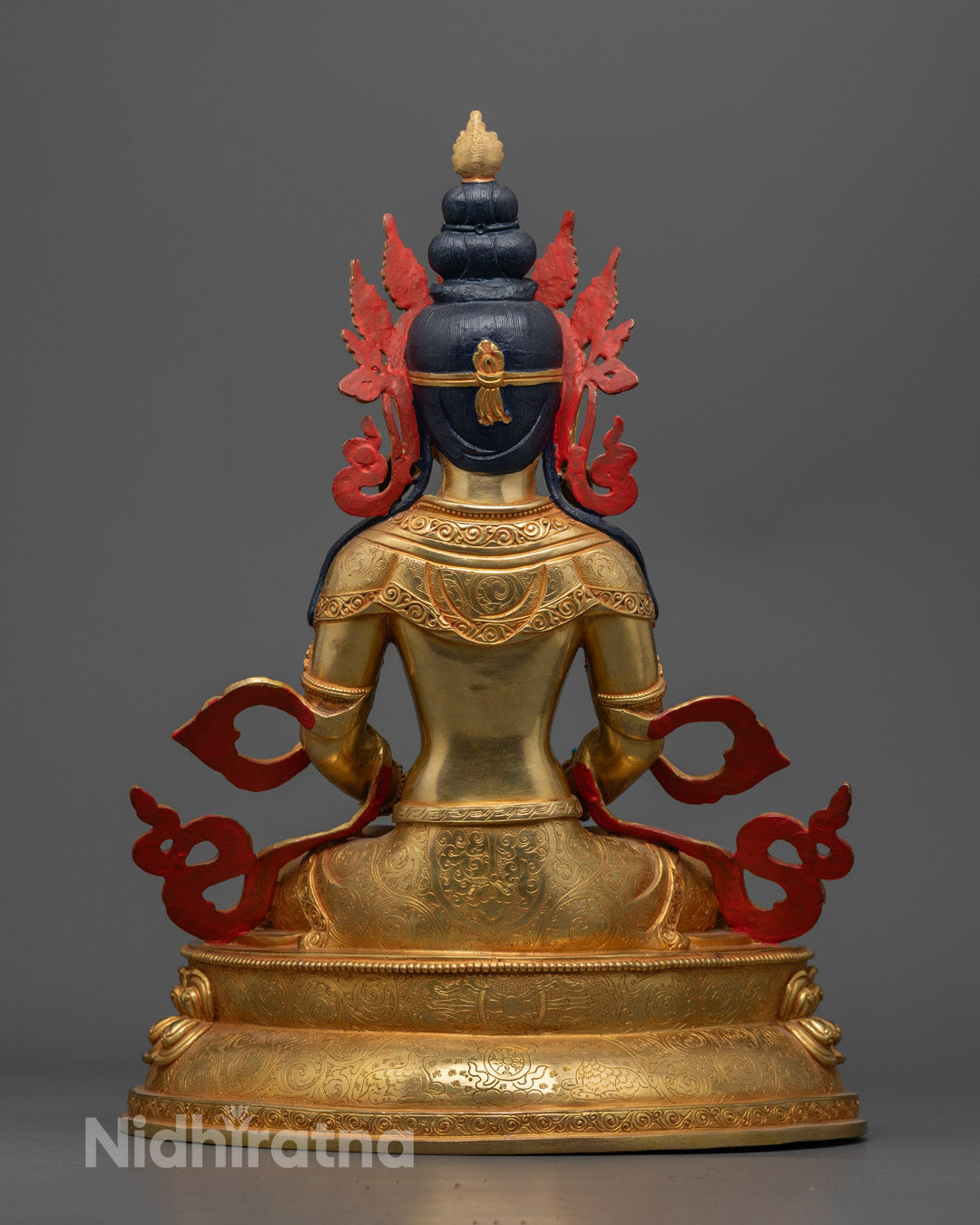 Vibrantly colored Amitayus Statue painted with acrylics, highlighting the detailed craftsmanship and semi-precious stone adornments.