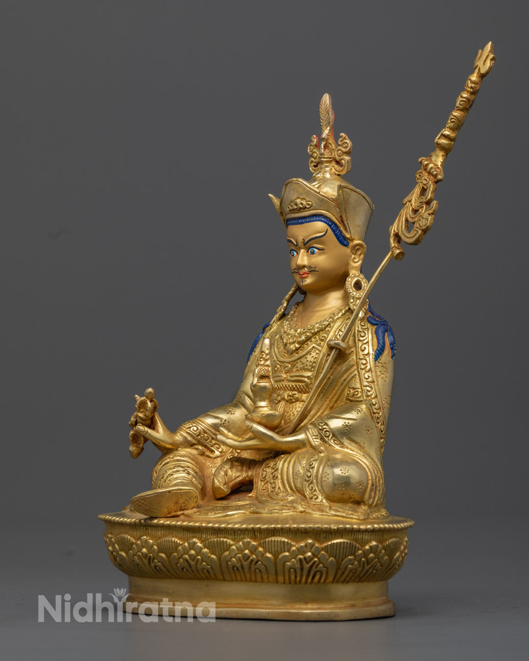 Weighing 1.55kg, this 24.5cm gold-plated Guru Rinpoche statue is perfect for meditation spaces and home decor, offering blessings of protection and enlightenment.