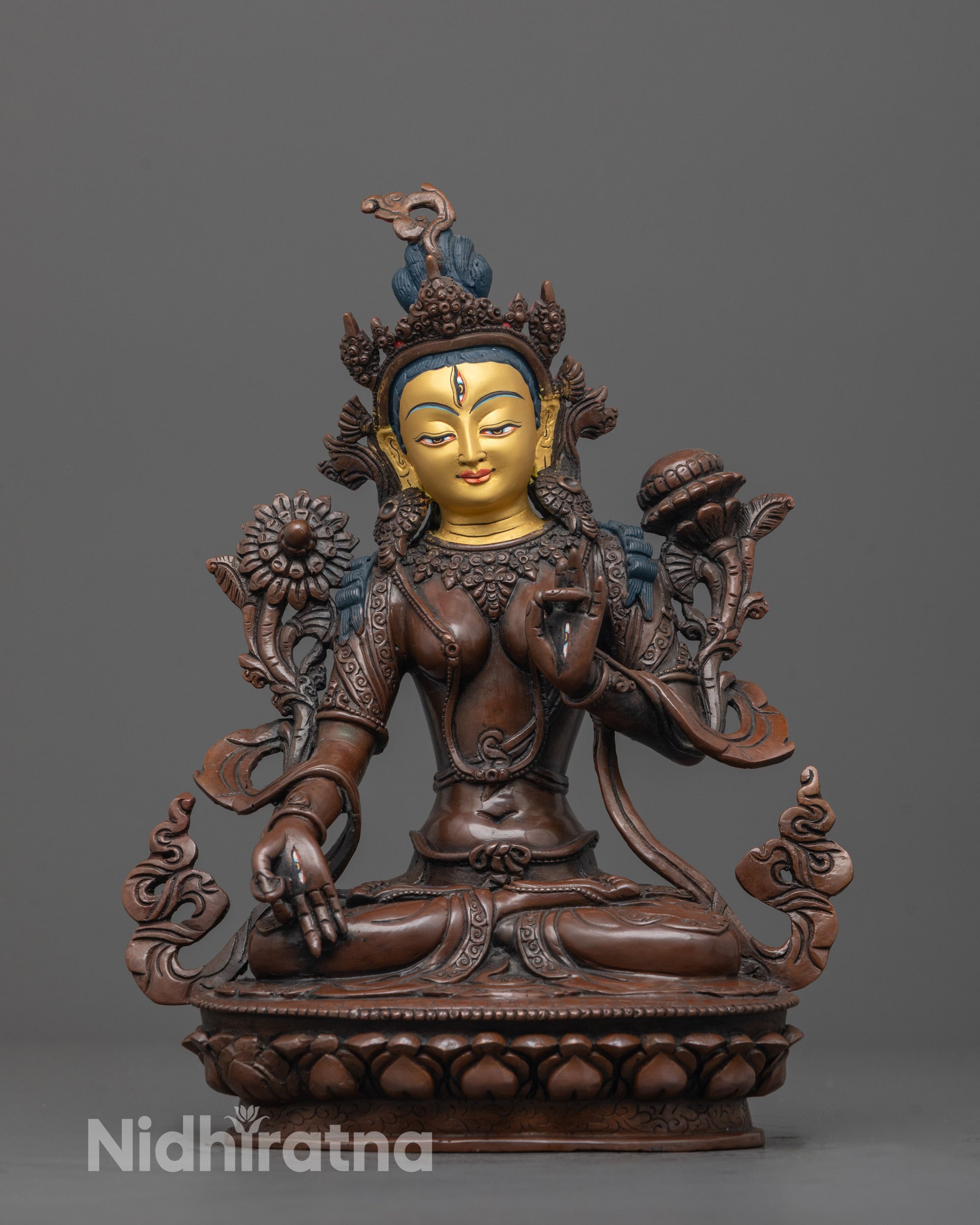 Front view of Handcrafted White Tara Statue with gold-gilded face and oxidized copper body
