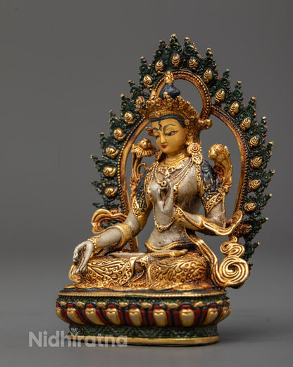 Detailed carving on White Tara statue’s crown, jewelry, robes, and uptala flowers with rich acrylic paint