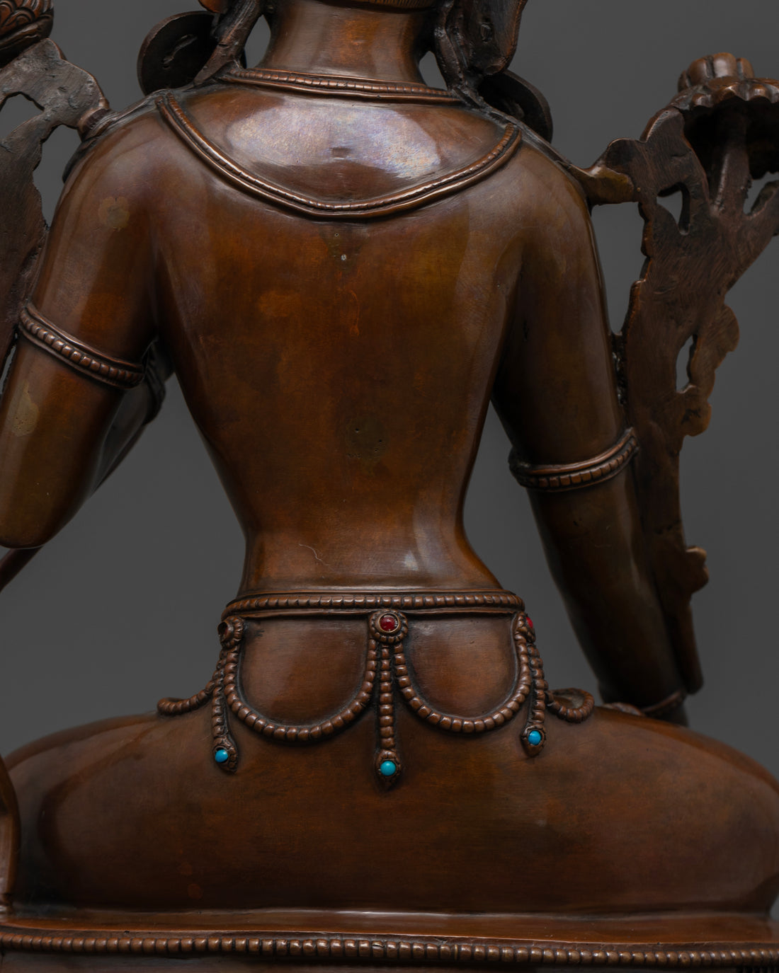 back view of brown oxidized white tara statue