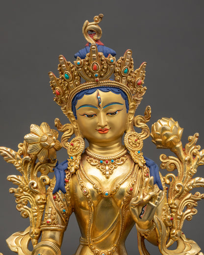 White Tara Buddha showing seven eyes, gold-painted face, vibrant colors