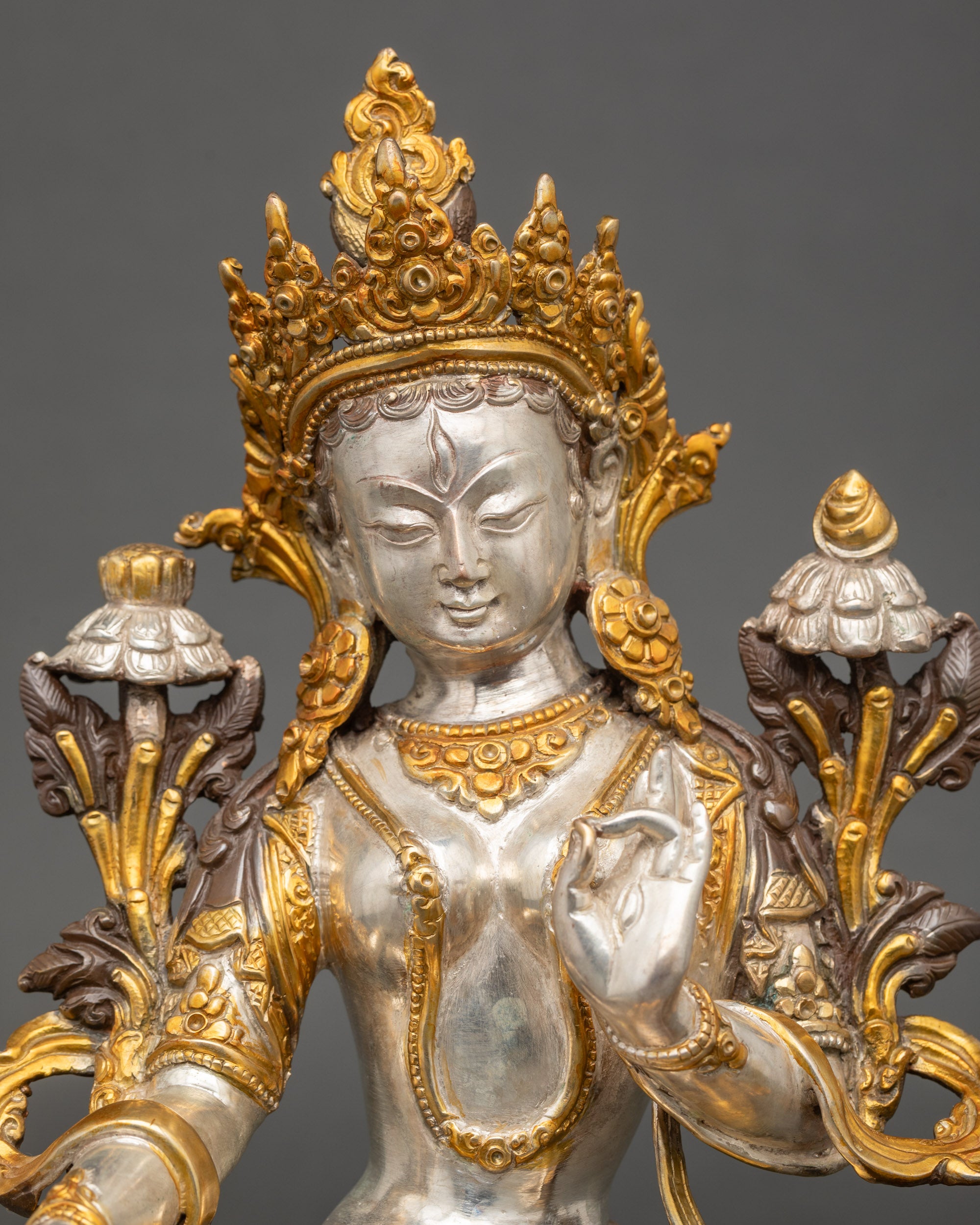 White Tara Buddha with seven eyes in Varada Mudra for spiritual blessings