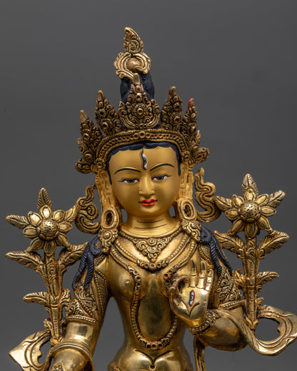 White Tara Statue close up of hand-carved patterns on robes and lotus seat
