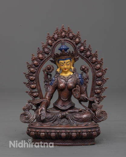 White Tara Statue front view showing gold-plated face and oxidized copper body with halo