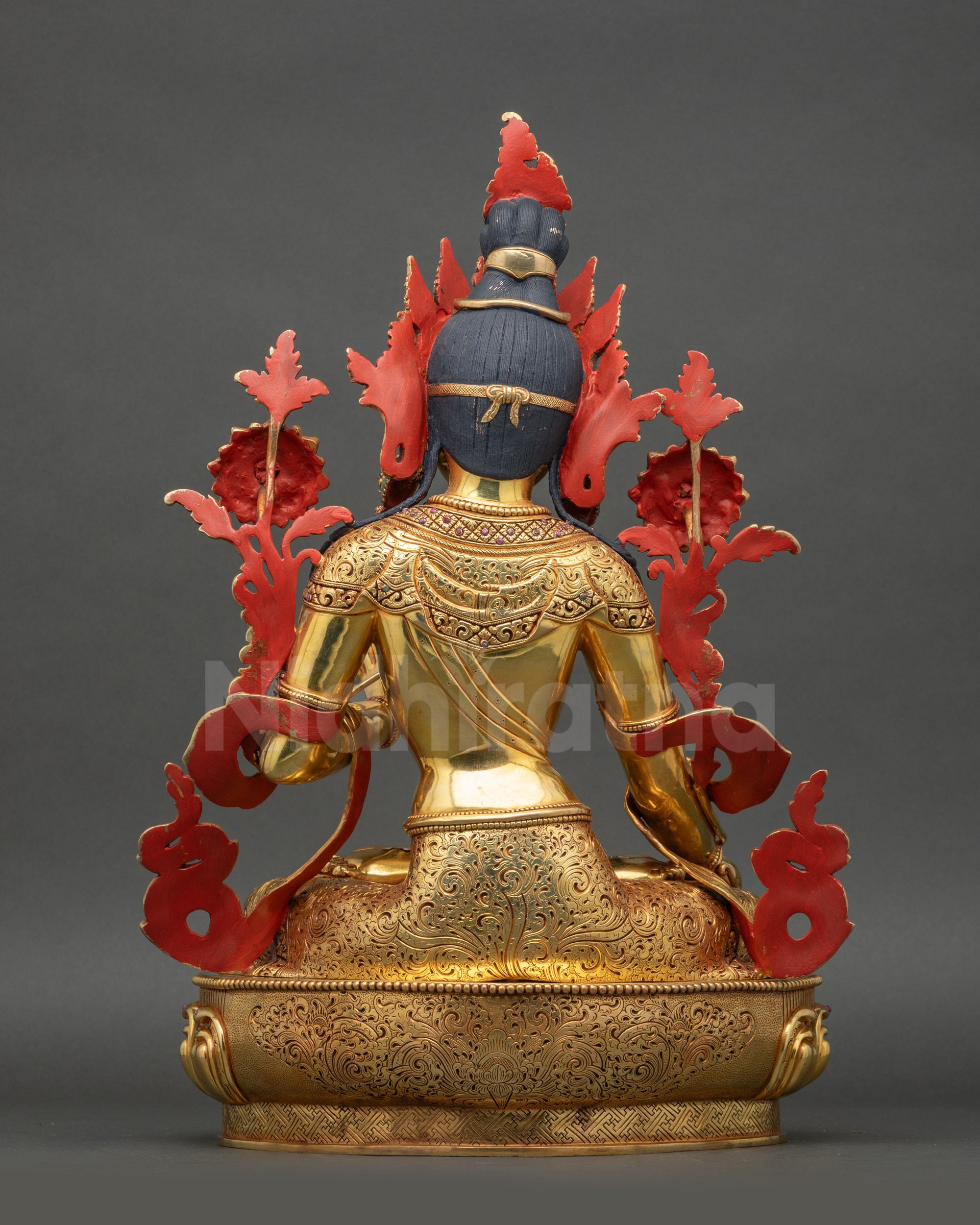 White Tara back view showing carved lotus seat and detailed copper artistry