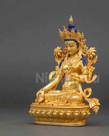 White Tara deity sculpture seated on lotus representing healing and long life