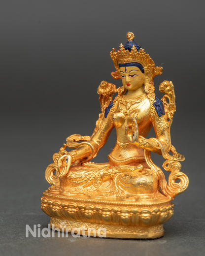 White Tara sculpture showing utpala flower and Varada Vitarka Mudra hands