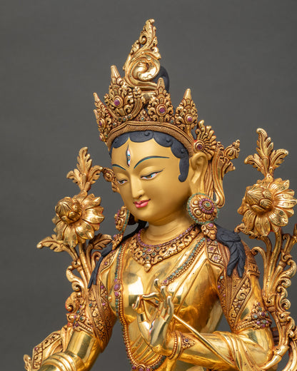 White Tara side view highlighting gilded ornaments and lotus seat details