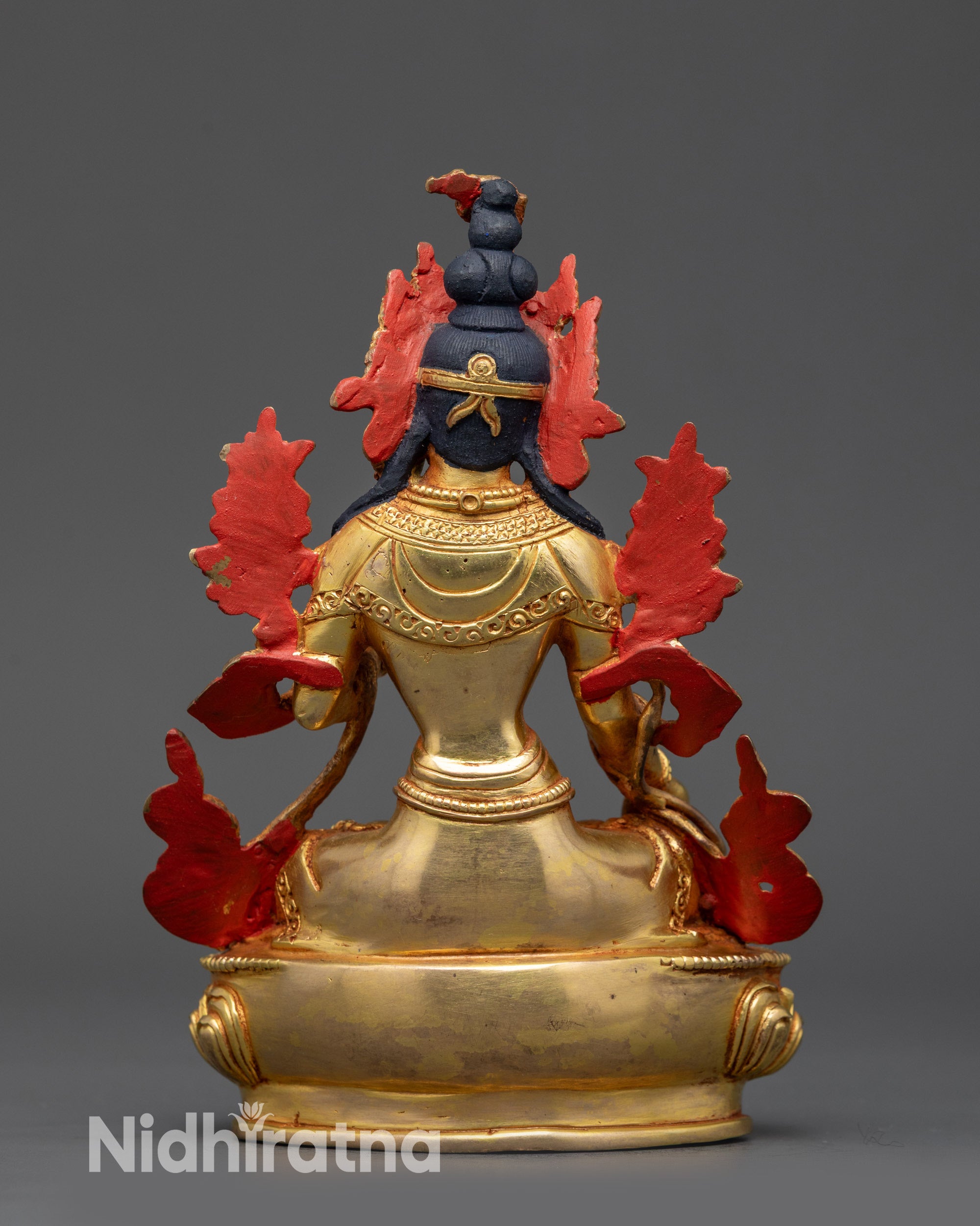 White Tara statue back view copper alloy body with flowing robes and fire-gilded finish