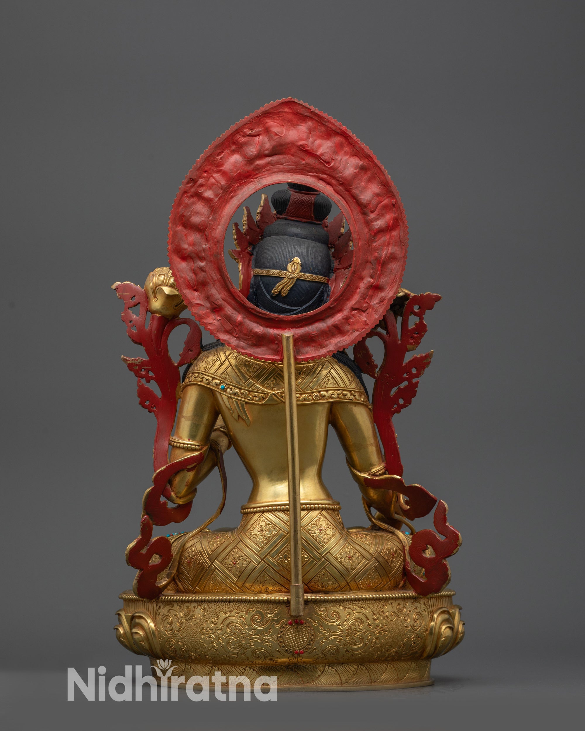 White Tara statue back view with detailed robe carvings and lotus seat design