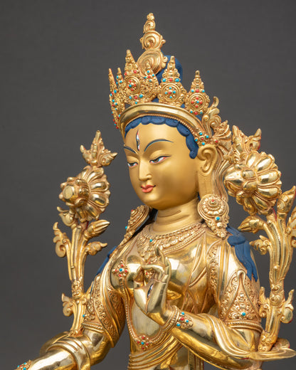 White Tara statue detailed side close up with jeweled crown and flowing robe