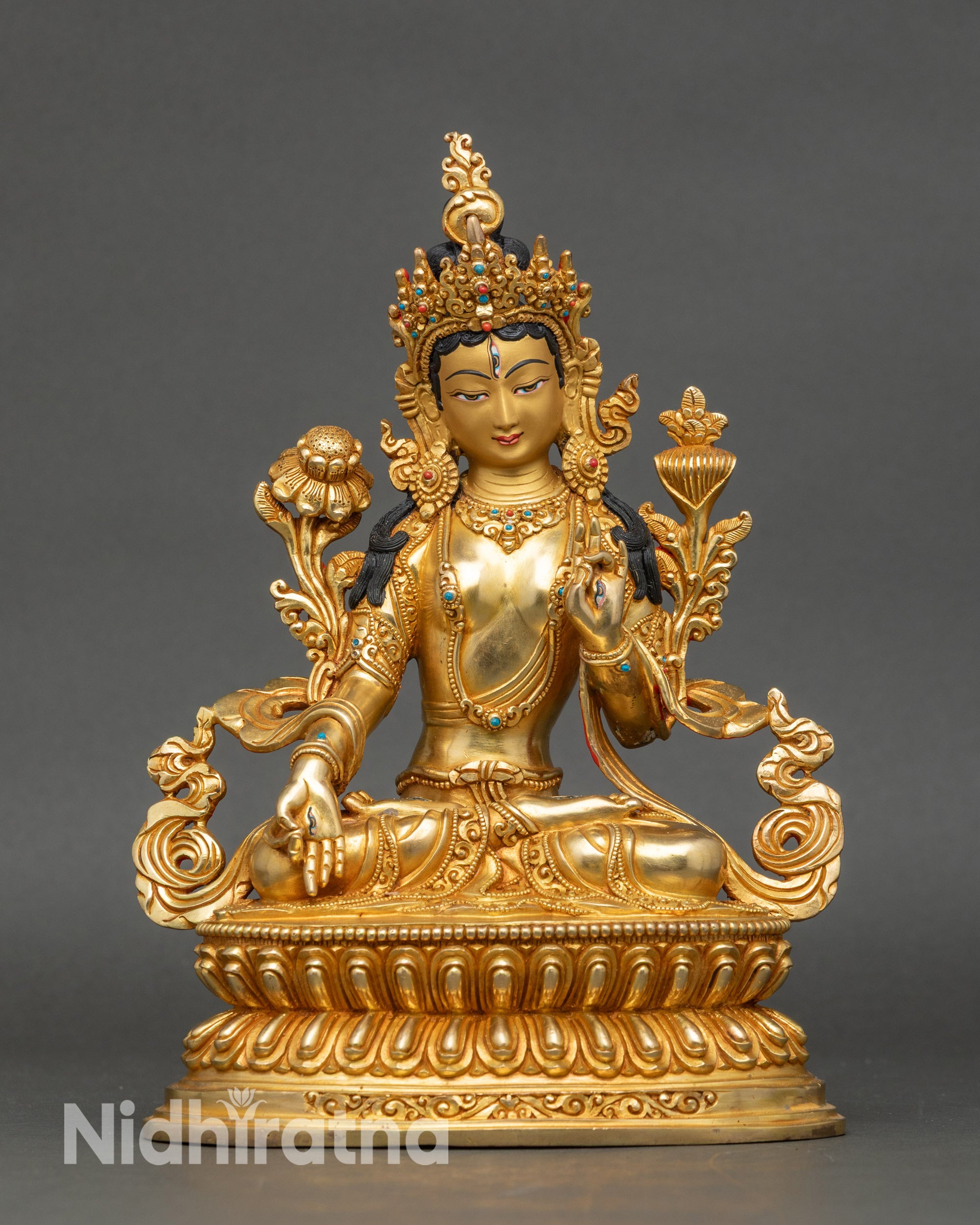 White Tara statue with seven eyes, fire gilded copper, seated on lotus throne