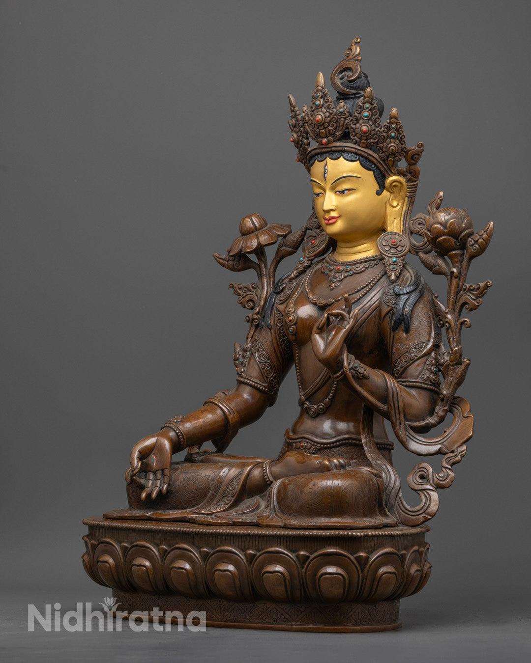 Authentic Nepalese Buddhist statue of White Tara, hand-carved, adorned with gemstones and spiritual energy.
