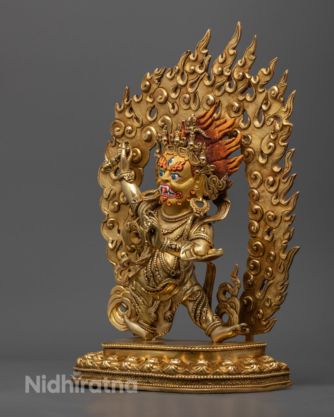 Wrathful expression of Vajrapani Bodhisattva sculpture representing protector of Buddha’s teachings, ideal for meditation altar decor.