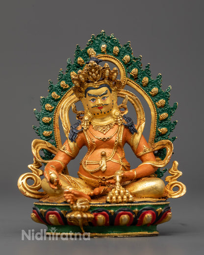 Yellow-Hued Dzambhala Statue with gold-plated face and acrylic-painted details, seated on a lotus throne